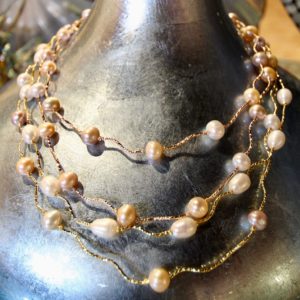 New Wave Pearls set on twisted Yellow gold string. Strand is 16” long.