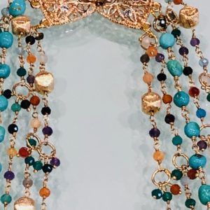 Five-strand, multi-gem necklace with golden nuggets and turquoise. Over 21' long. Gold clasp.