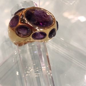 Oval  Brazilian 9-stone Amethyst ring in oval shape finished in 18 K  gold.